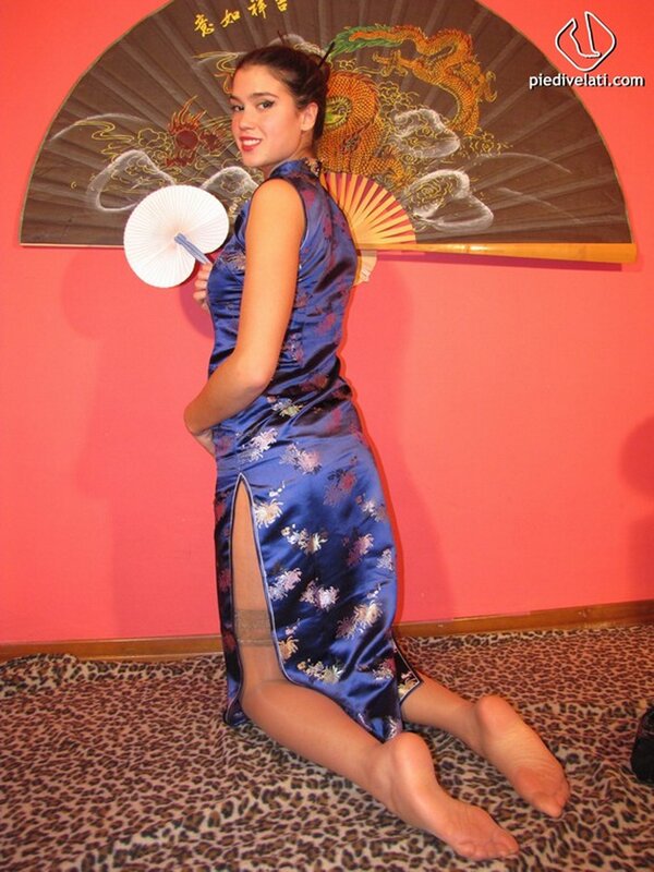 woman in blue dress with fans