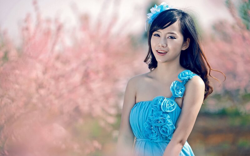 woman in blue dress with flowers