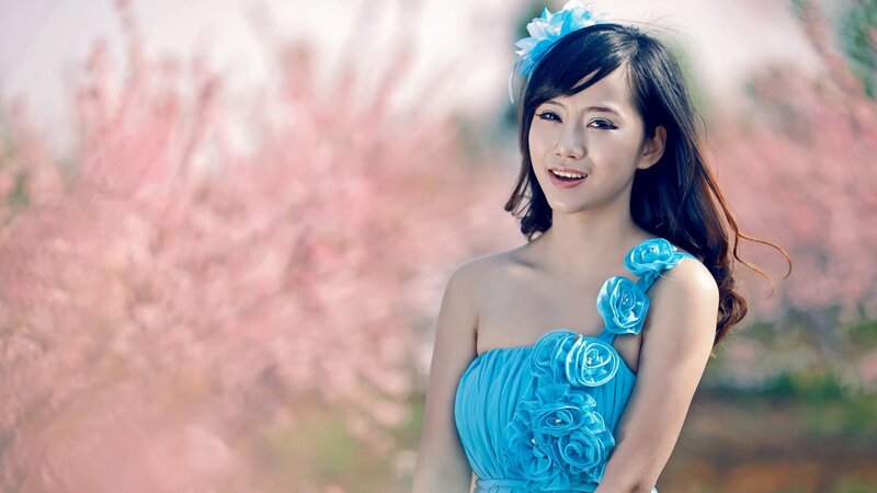 woman in blue dress with flowers