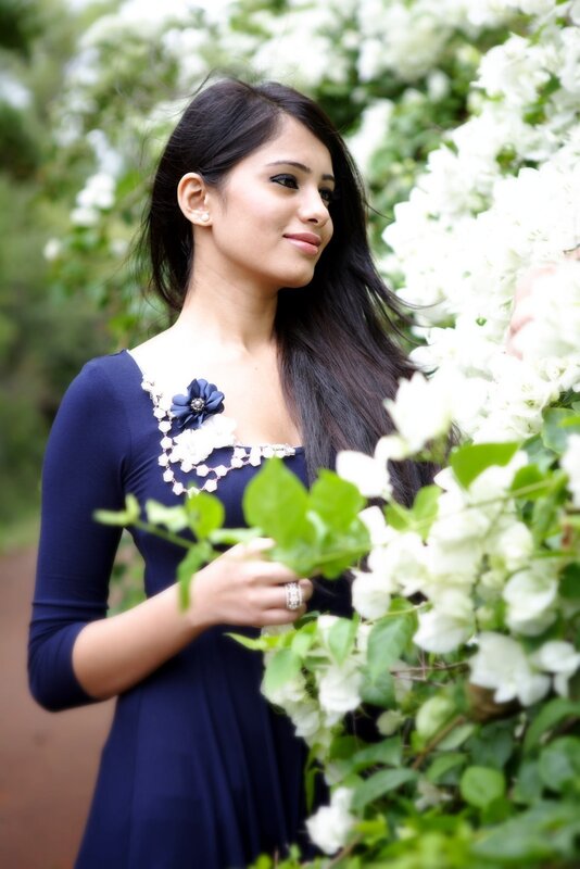 woman in blue dress with flowers