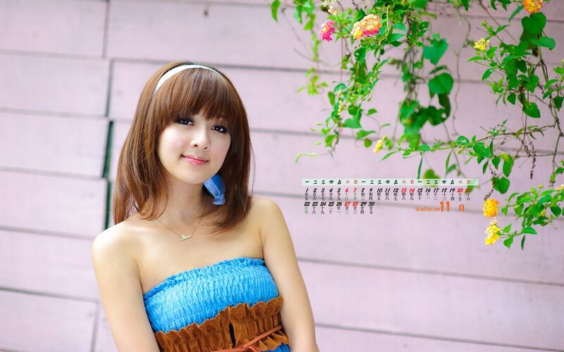 woman in blue dress with flowers