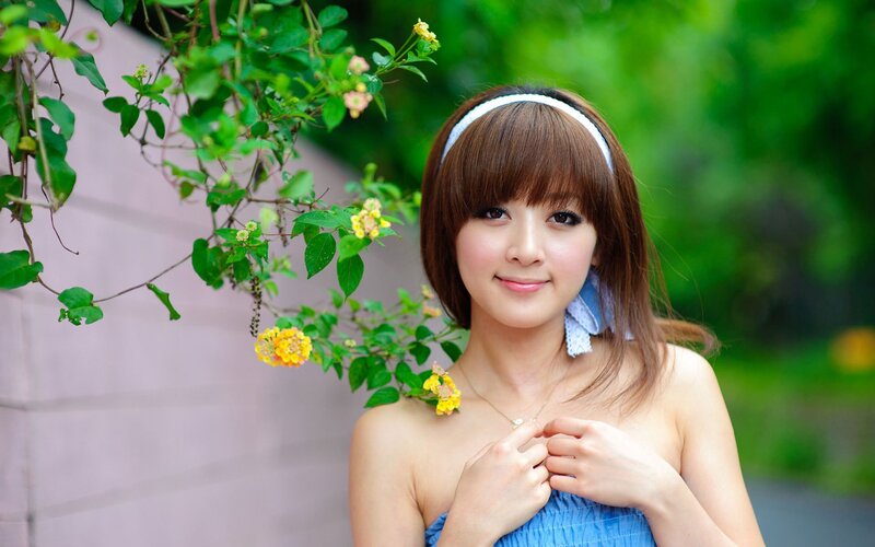 woman in blue dress with flowers