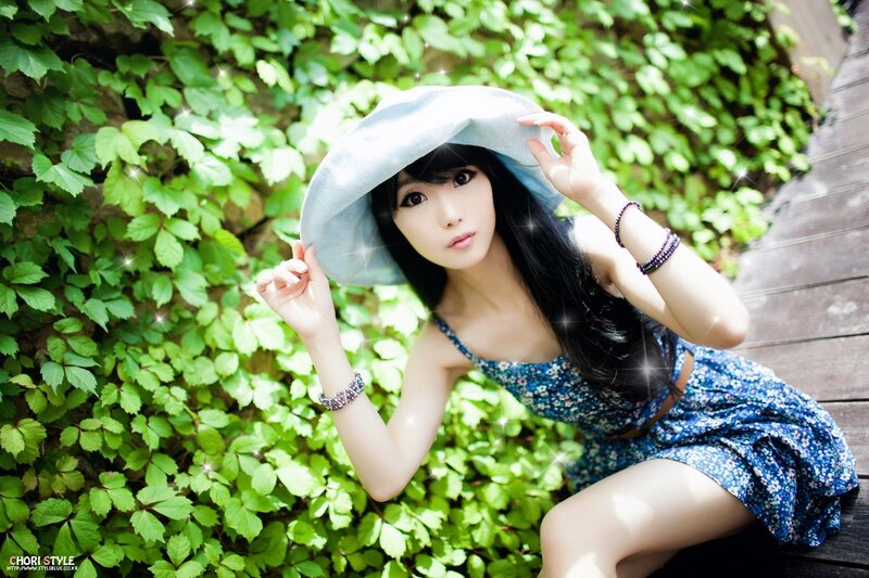 woman in blue dress with hat