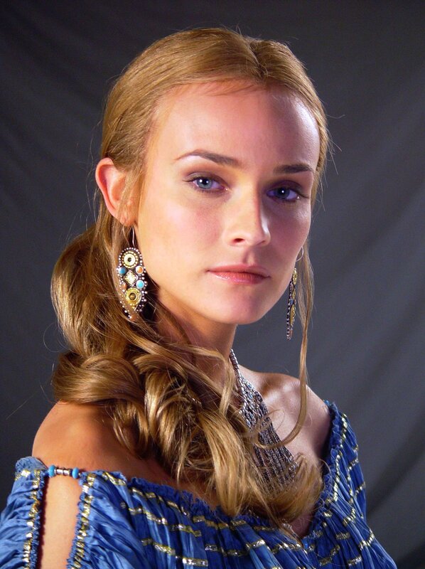 woman in blue dress with jewelry