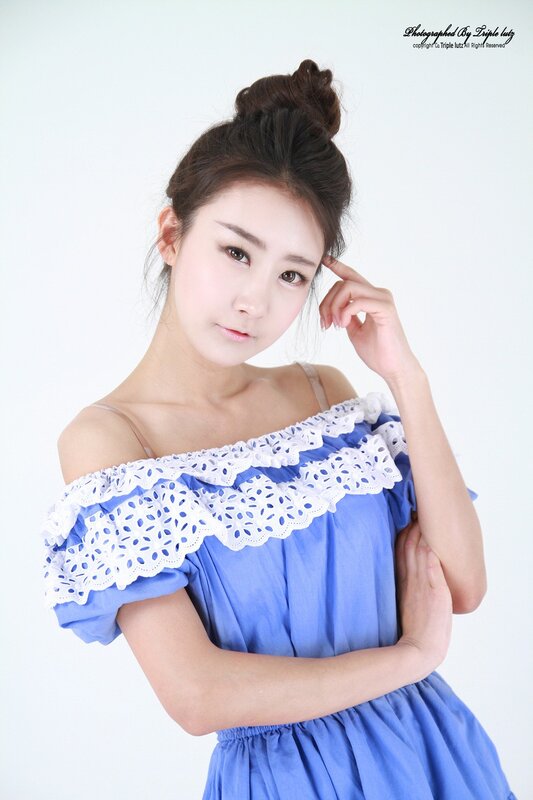 woman in blue dress with lace trim