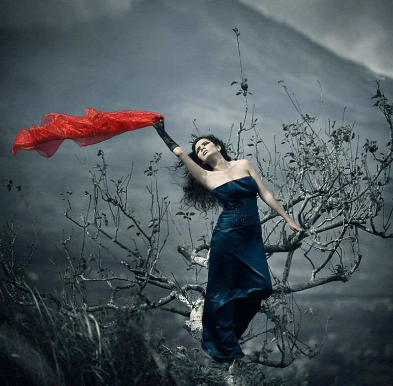 woman in blue dress with red scarf
