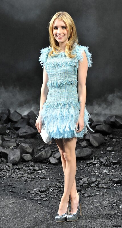 Woman in blue feather dress