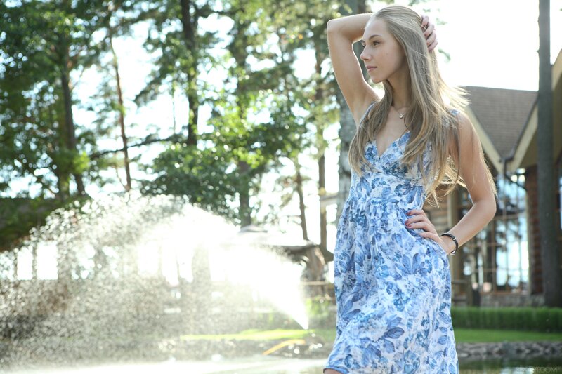 Woman in blue floral dress