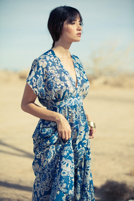 woman in blue floral dress