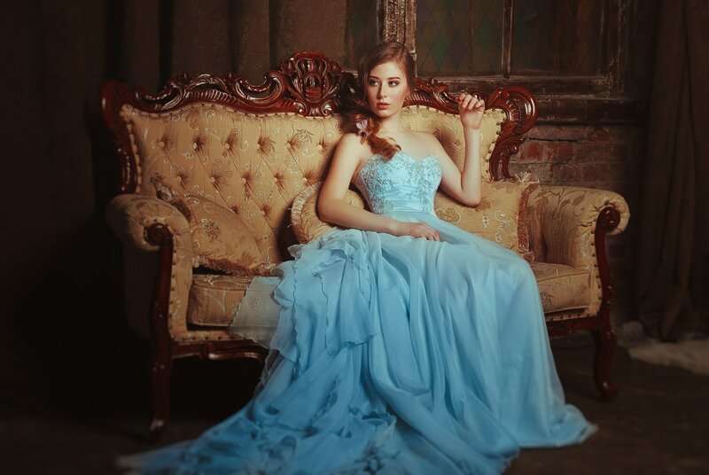 Woman in Blue Gown — Dramatic, Photograph, Couch