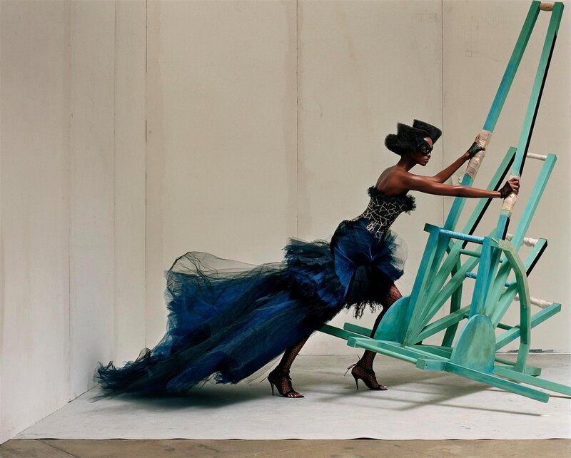 Woman in blue gown with mask