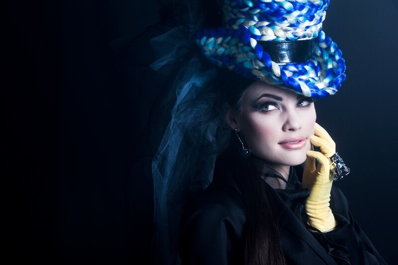 woman in blue hat and yellow gloves