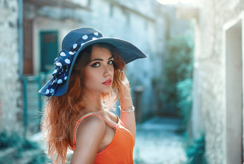 Woman in Blue Hat — Orange