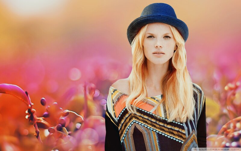 woman in blue hat with flowers