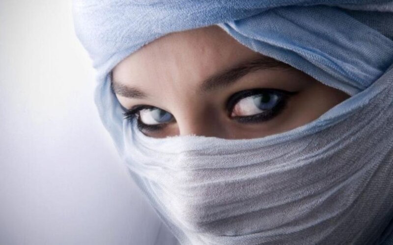 woman in blue headscarf