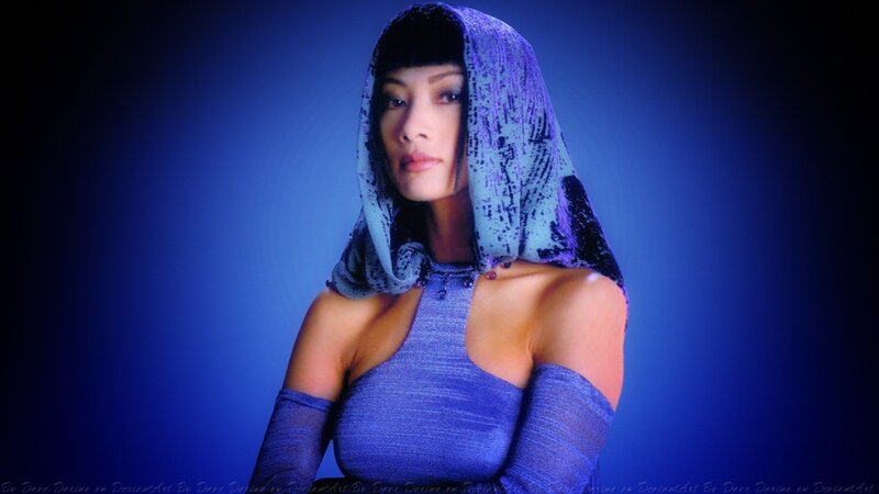 Woman in Blue Hooded Outfit — Dramatic
