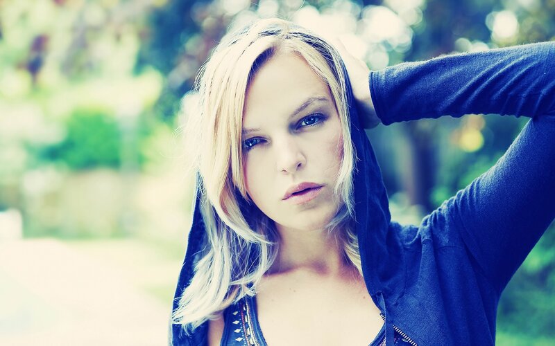 woman in blue hoodie outdoors