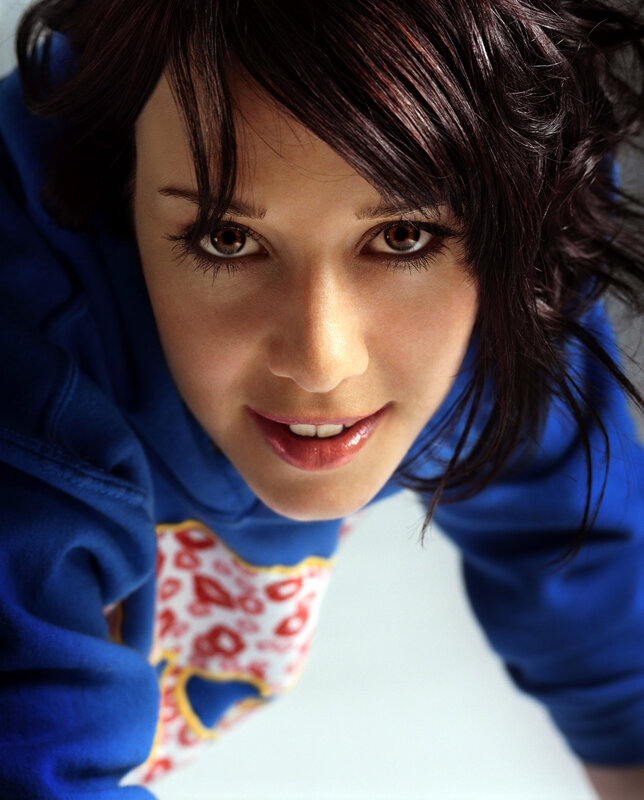 woman in blue hoodie smiling
