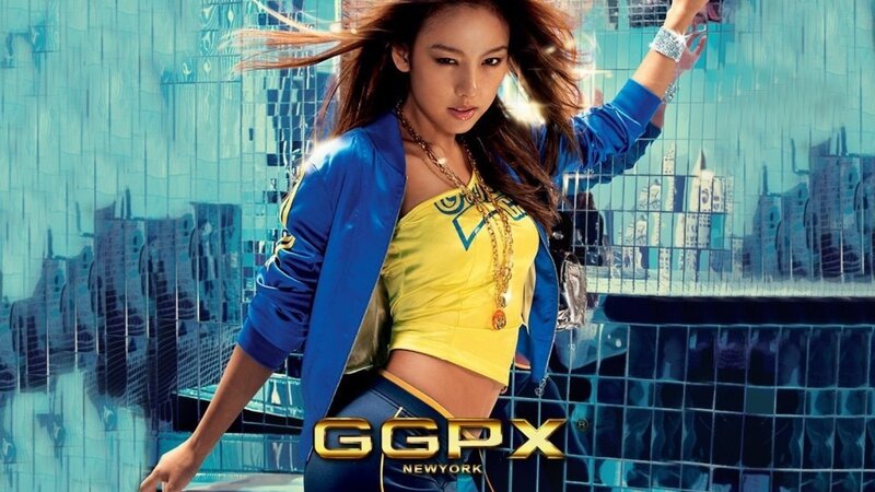 woman in blue jacket and yellow top