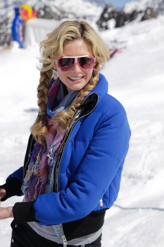 woman in blue jacket on snow