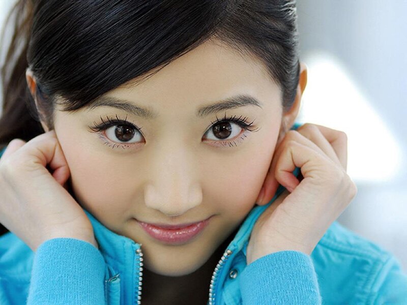 woman in blue jacket smiling