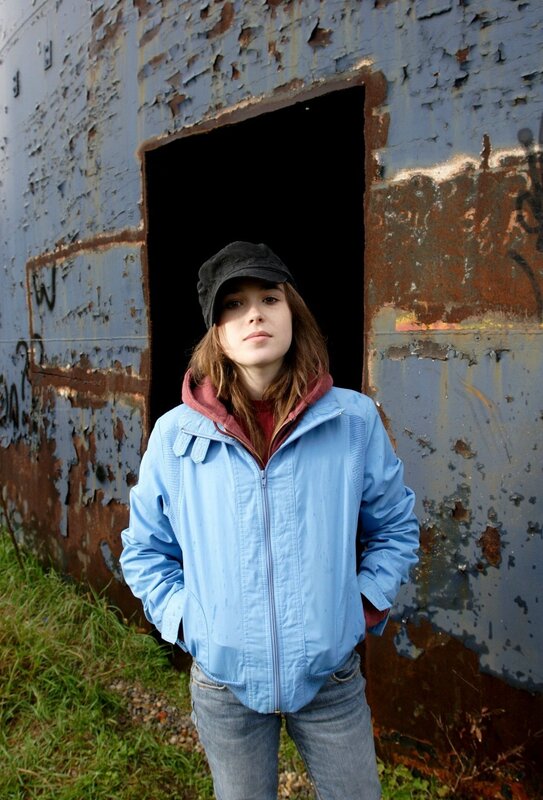 woman in blue jacket standing outside