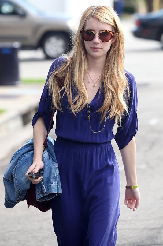 Woman in blue jumpsuit walking