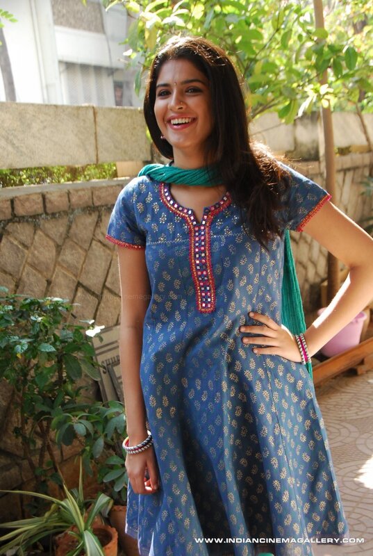 woman in blue kurta smiling