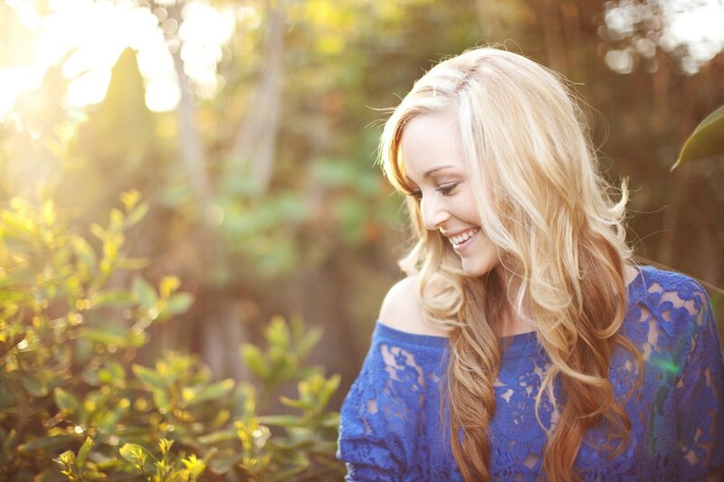 woman in blue lace smiling