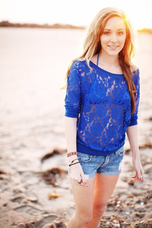 woman in blue lace top on beach