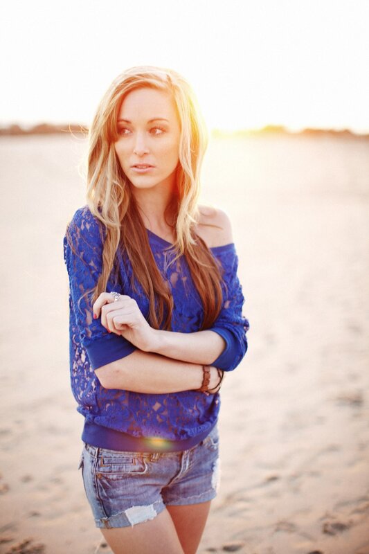 woman in blue lace top on beach