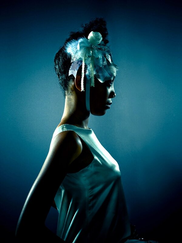 woman in blue light with headpiece