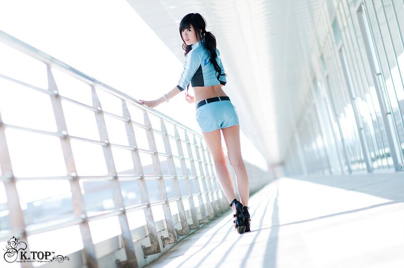 woman in blue outfit on bridge