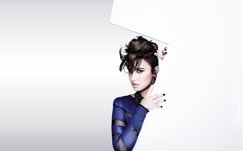 woman in blue outfit peeking