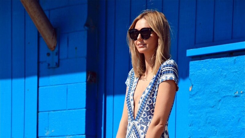 woman in blue patterned dress