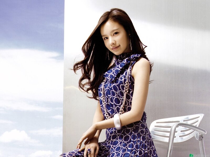 woman in blue patterned dress