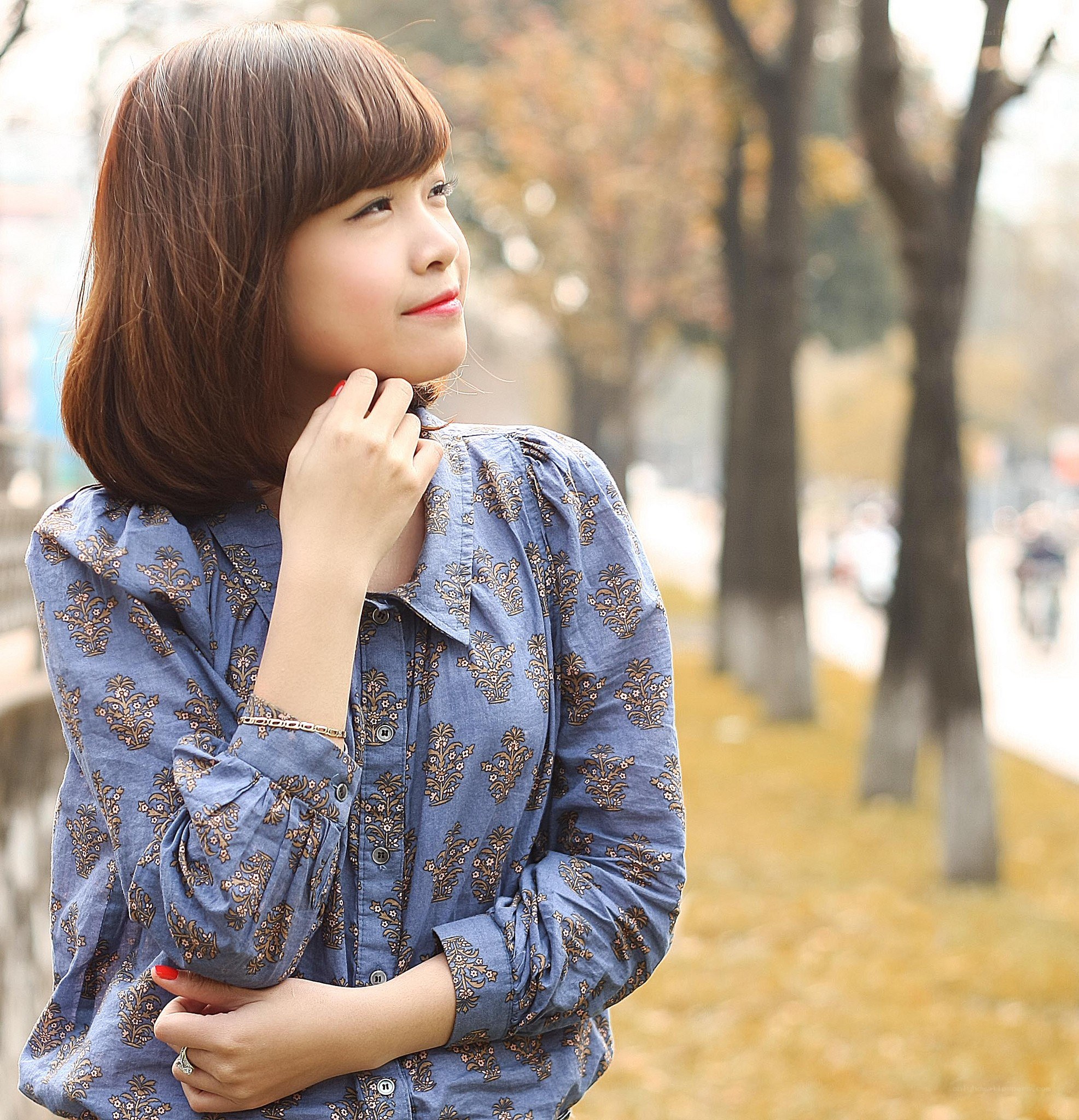 woman in blue patterned shirt