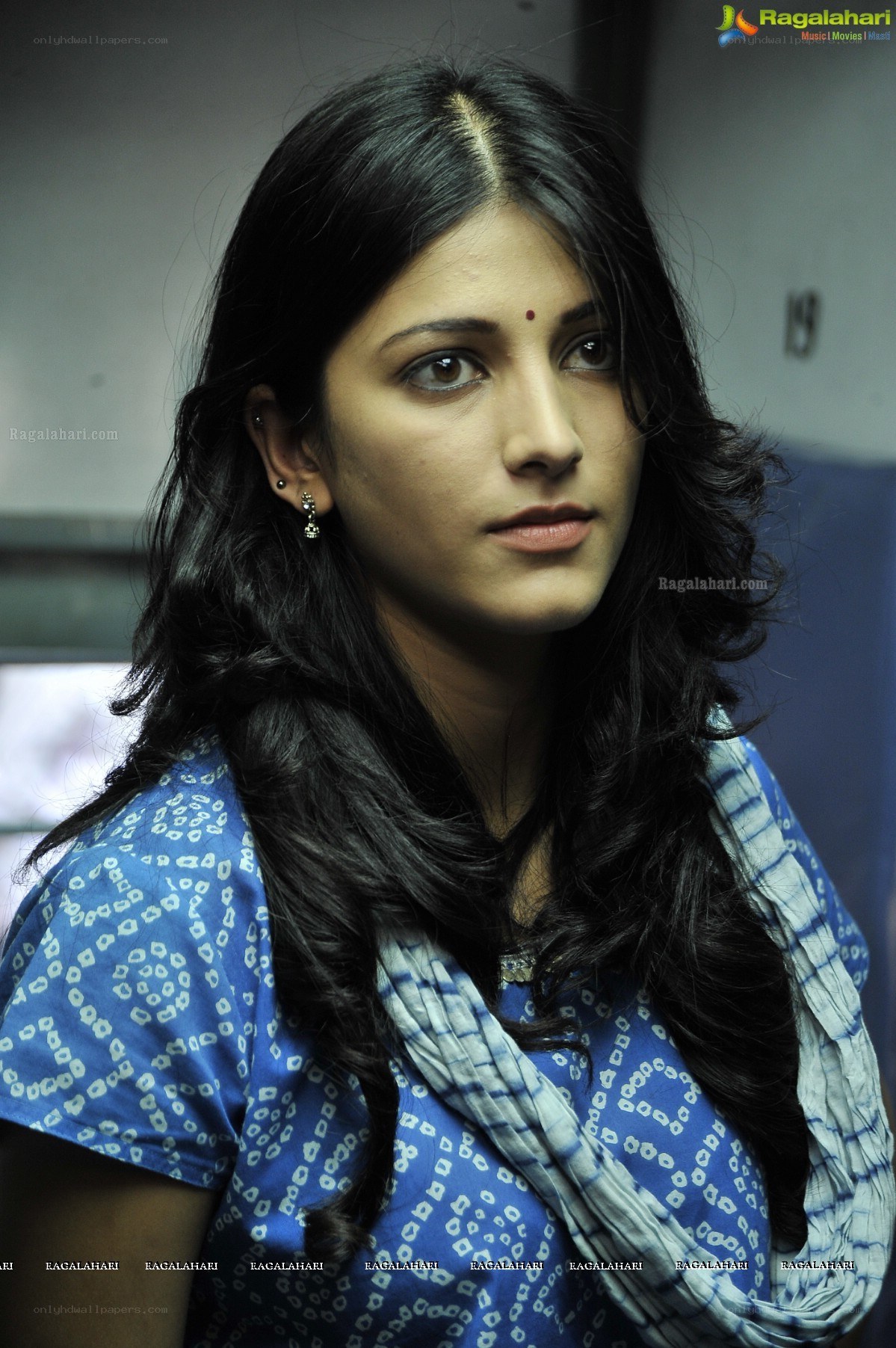 woman in blue patterned top