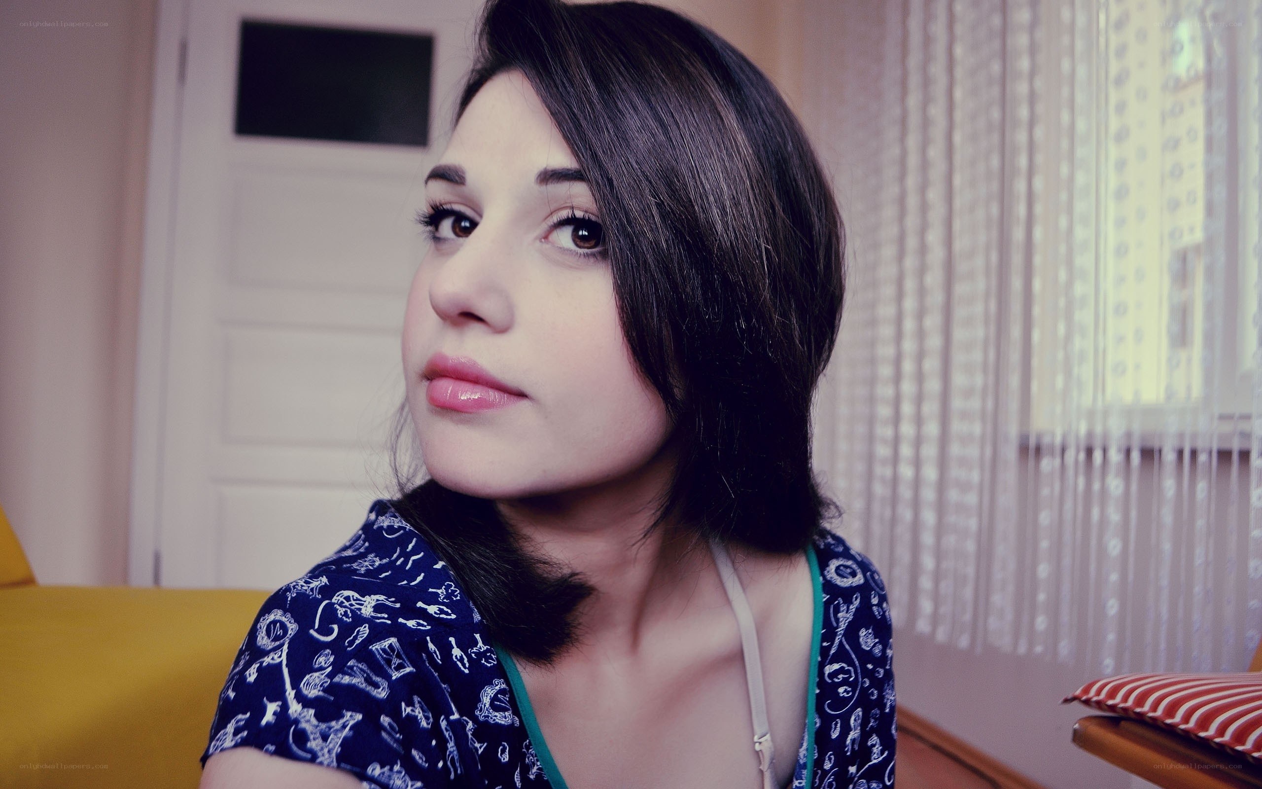 woman in blue patterned top