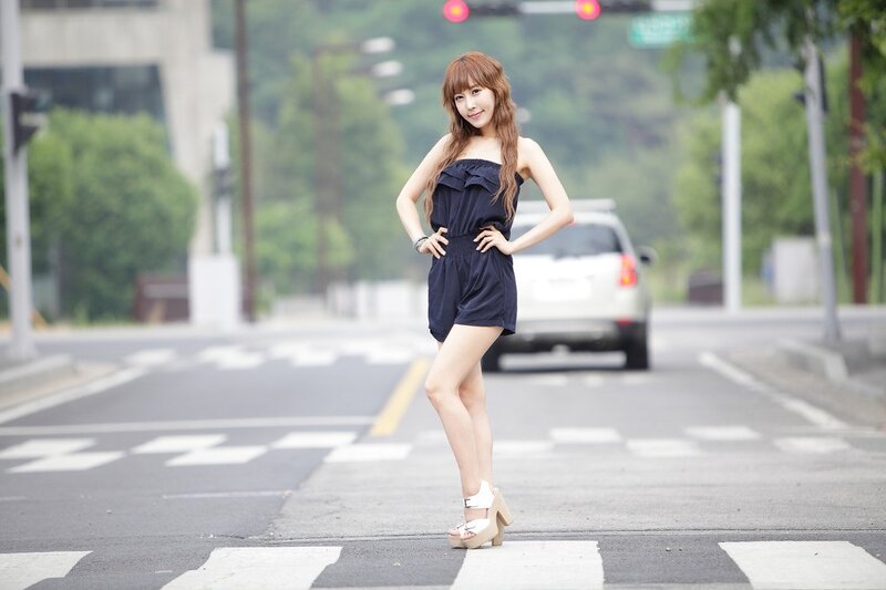 Woman in blue romper on street