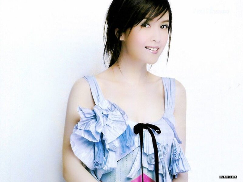 woman in blue ruffled top