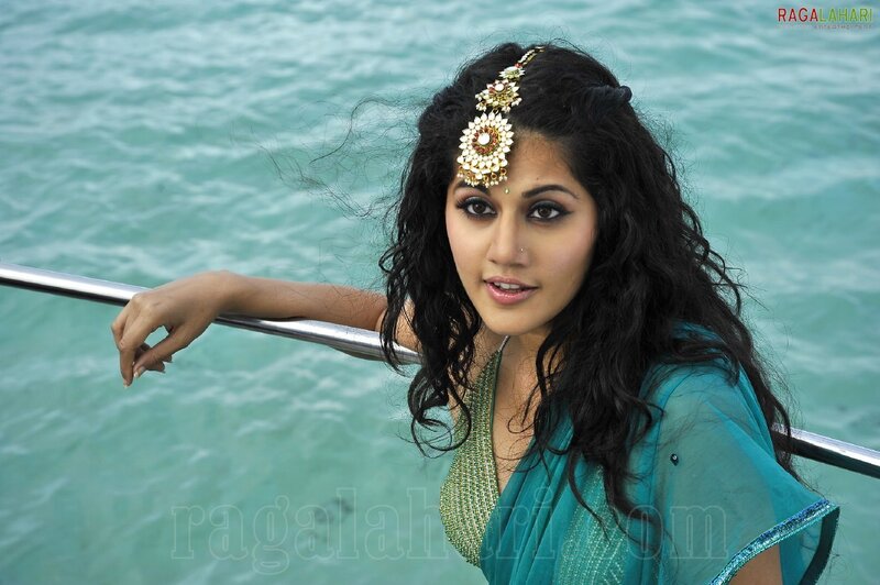 woman in blue sari by water