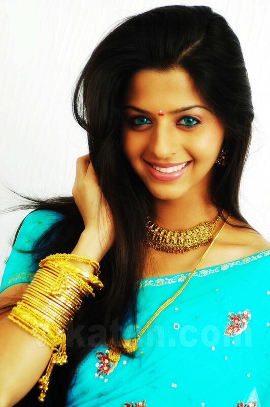 woman in blue sari smiling