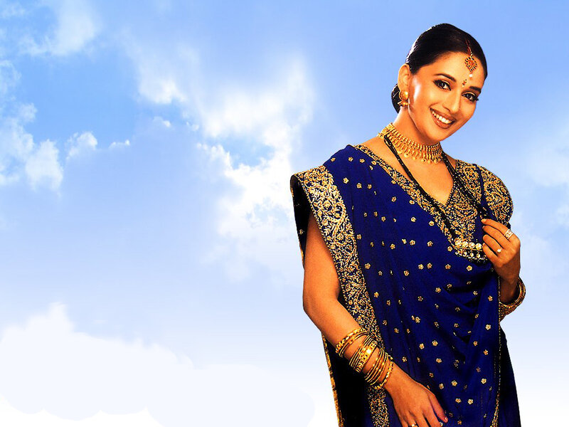 woman in blue sari smiling