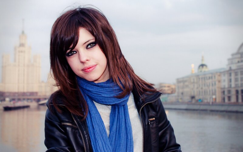 woman in blue scarf by river
