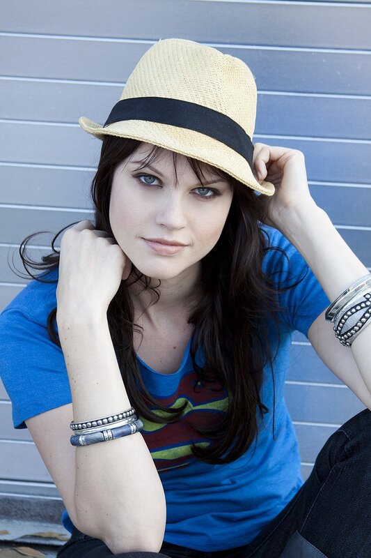 woman in blue shirt and hat