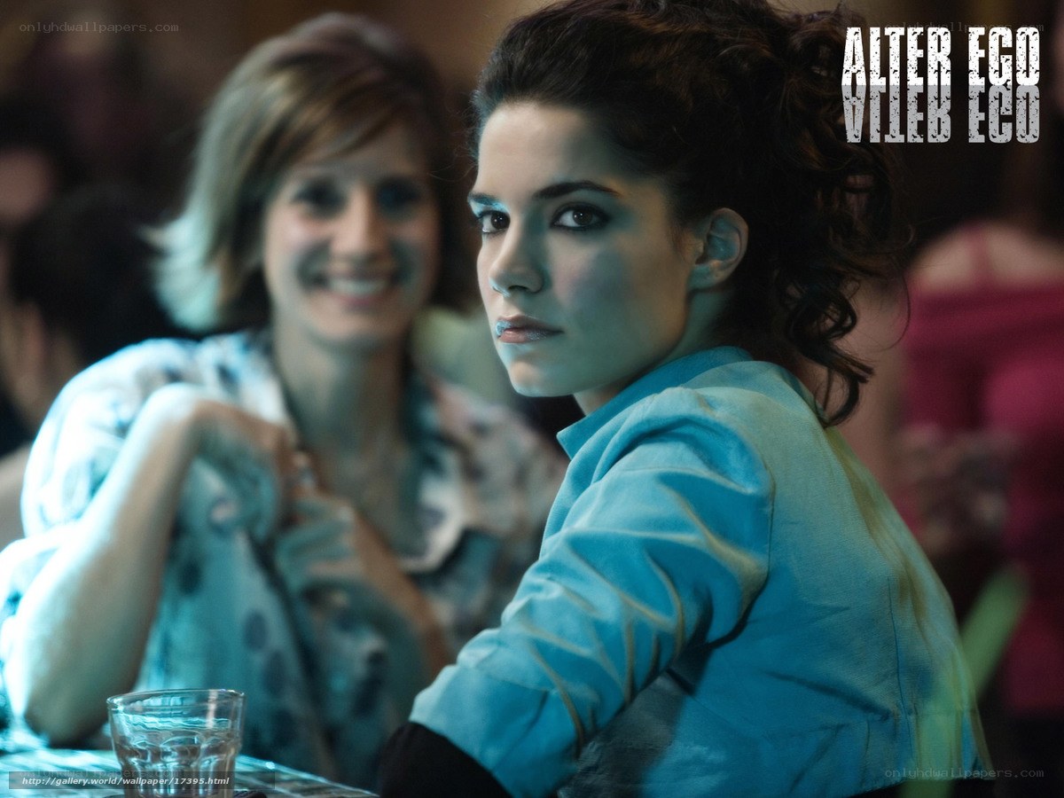 woman in blue shirt at bar
