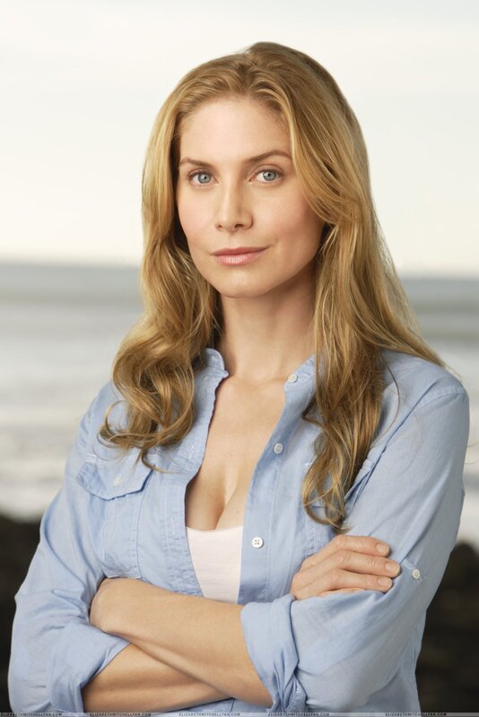 woman in blue shirt at beach