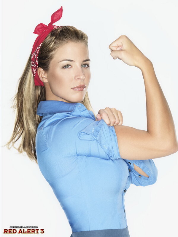 woman in blue shirt flexing