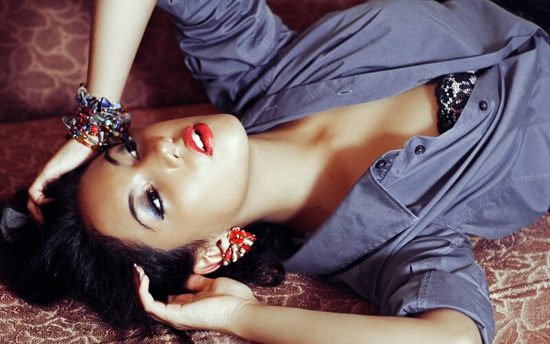 woman in blue shirt lying down